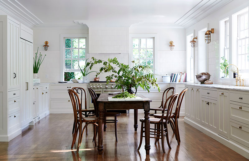 designer kitchen with featured wooden table and chairs