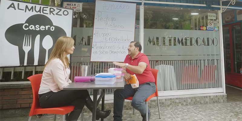 Angelica Rodriguez meeting with a colleague outside a restaurant