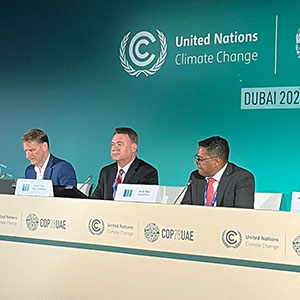 Scott Tew speaking at a COP28 panel