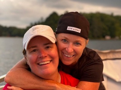 Jody and Michelle on their pontoon boat at their cabin.